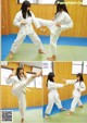 A woman in a white kimono is practicing karate. 