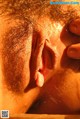 A close up of a man sticking out his tongue.